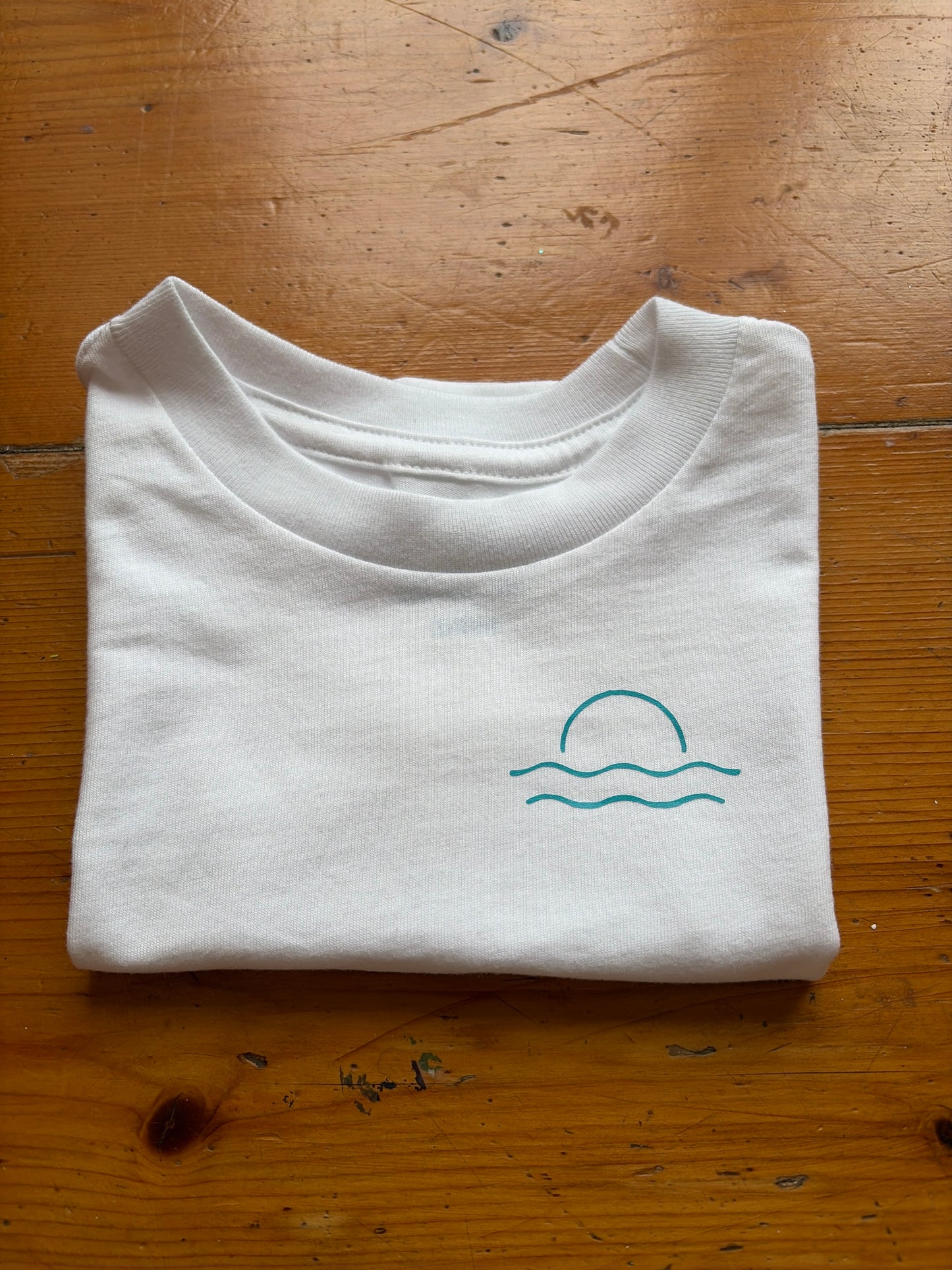 White with turquoise Mordros logo age 3-6 months