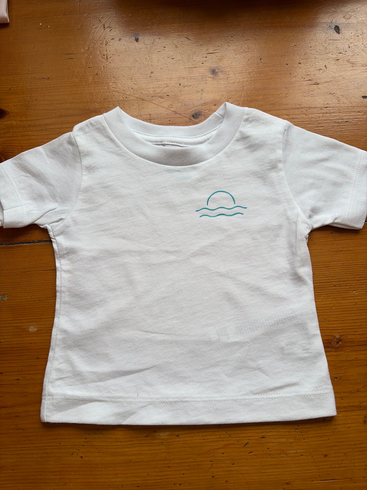 White with turquoise Mordros logo age 3-6 months